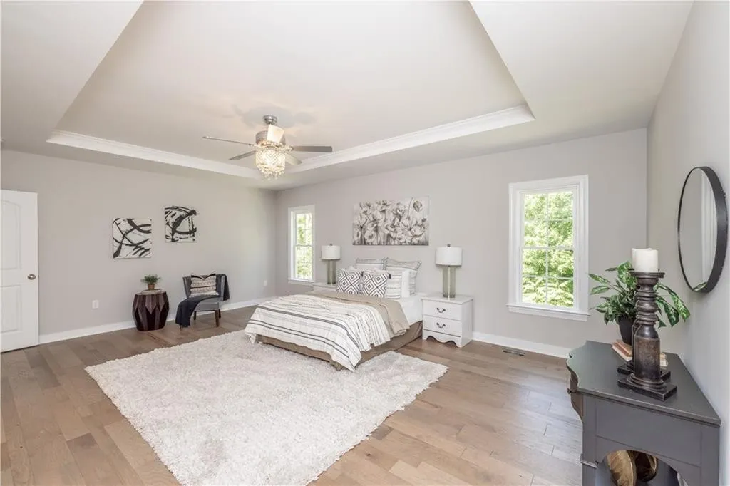 bedroom with tiered ceiling