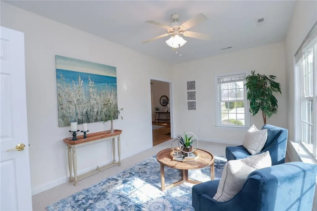 sitting room with 2 blue chairs